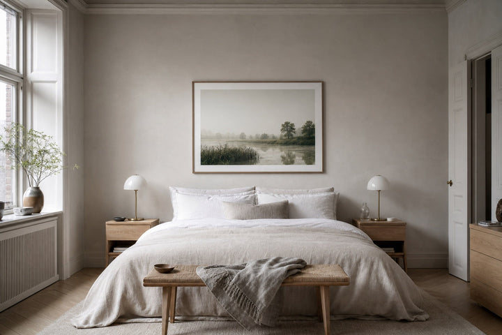 Nordic editorial serene bedroom featuring calm framed wall art correctly scaled above a linen bed