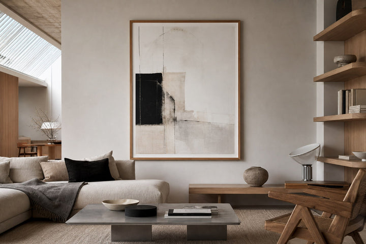 Nordic editorial well-proportioned Nordic living room featuring correctly scaled framed art demonstrating the format and placement described by the article