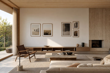 Nordic editorial well-proportioned Nordic living room featuring correctly scaled framed art demonstrating the format and placement described by the article