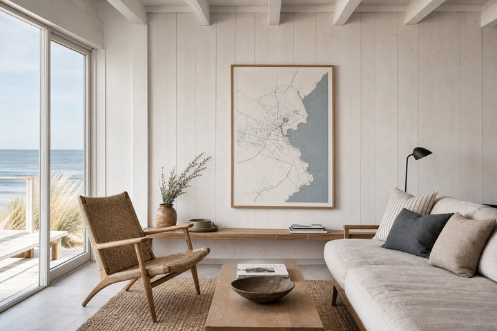 Nordic editorial Nordic coastal or travel-inspired sitting room featuring framed art that evokes place, horizon and travel memories