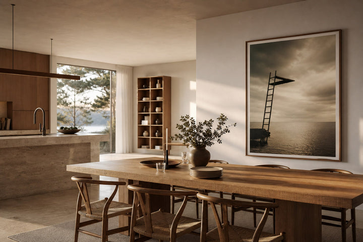 Nordic editorial Nordic kitchen and dining area featuring topic-relevant framed art placed safely away from heat and moisture