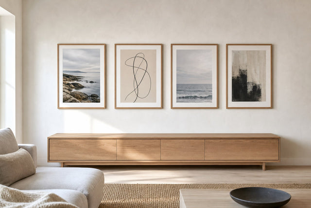 Nordic editorial refined Nordic living room featuring carefully composed framed-art vignette that directly illustrates the article subject