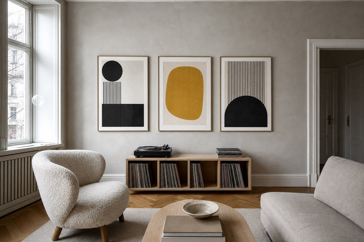 Nordic editorial refined Nordic living room featuring carefully composed framed-art vignette that directly illustrates the article subject
