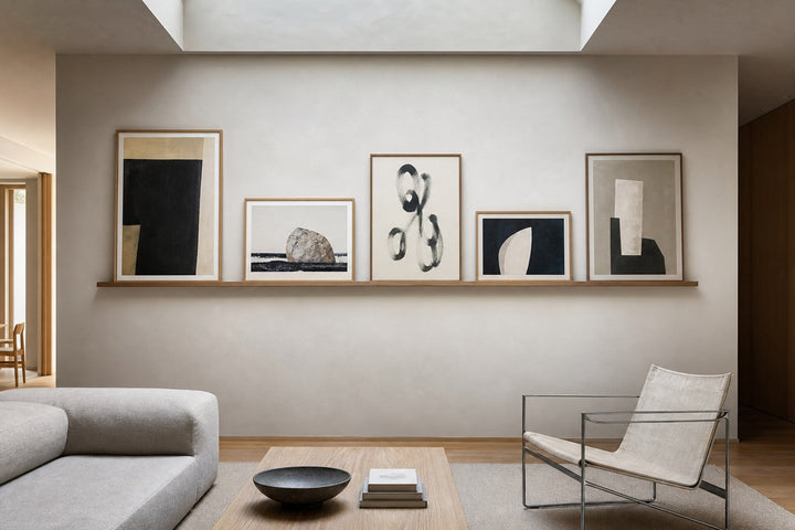 Nordic editorial refined Nordic living room featuring carefully composed framed-art vignette that directly illustrates the article subject