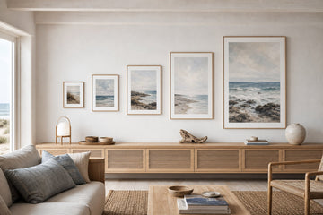 Nordic editorial well-proportioned Nordic living room featuring correctly scaled framed art demonstrating the format and placement described by the article