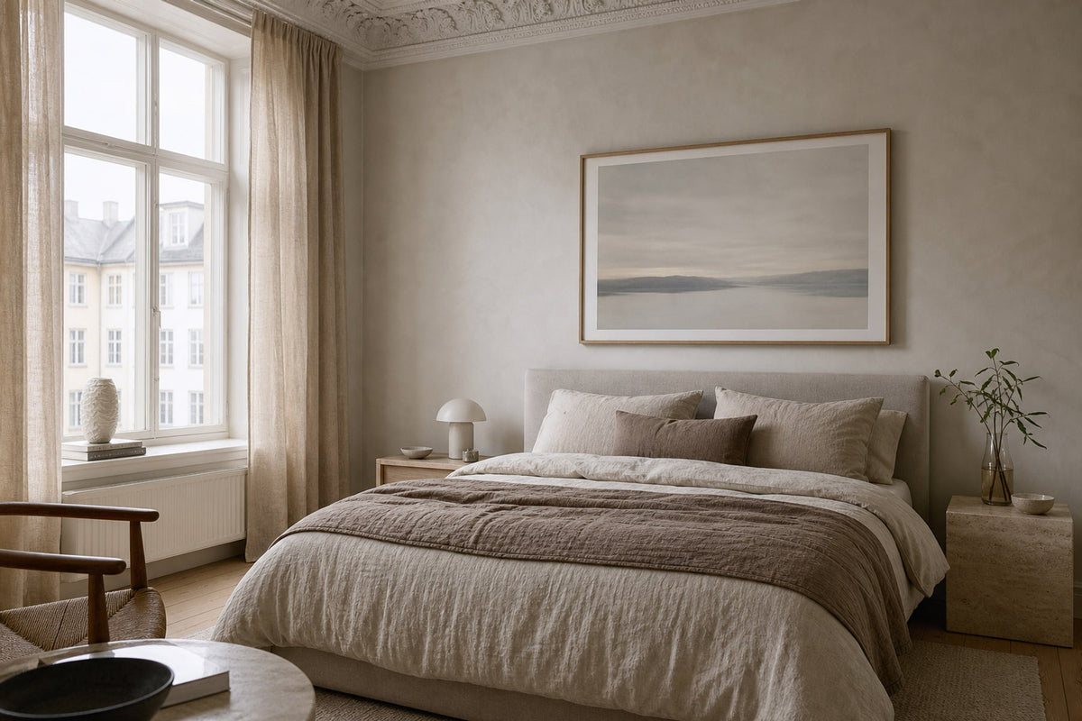 Nordic editorial serene bedroom featuring calm framed wall art correctly scaled above a linen bed