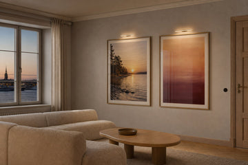 Nordic editorial refined Nordic living room featuring carefully composed framed-art vignette that directly illustrates the article subject