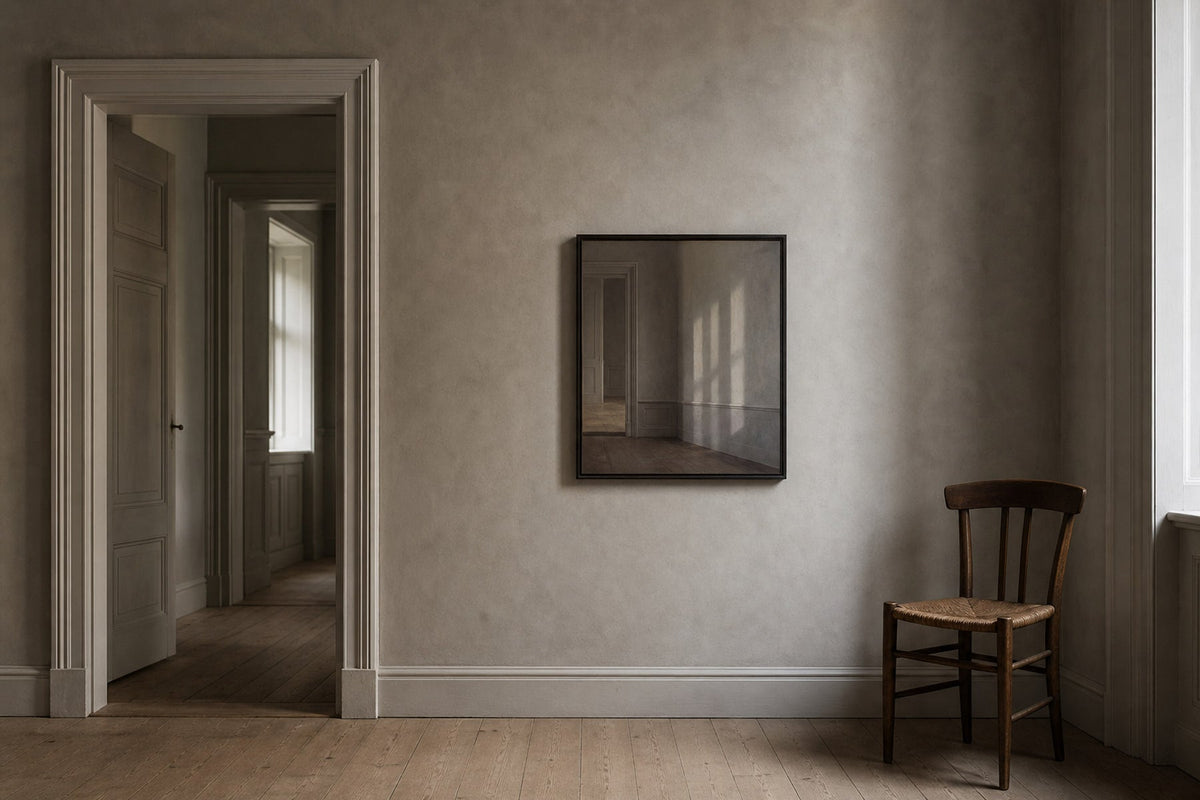 A quiet Nordic grey room with soft northern light and a restrained framed artwork inspired by the Hammershøi look